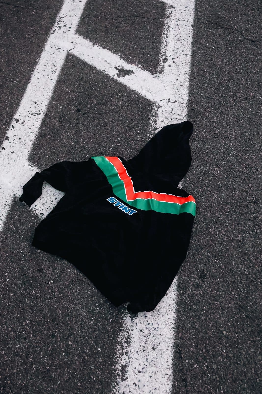 STINT Rotary Hoodie laid on a track