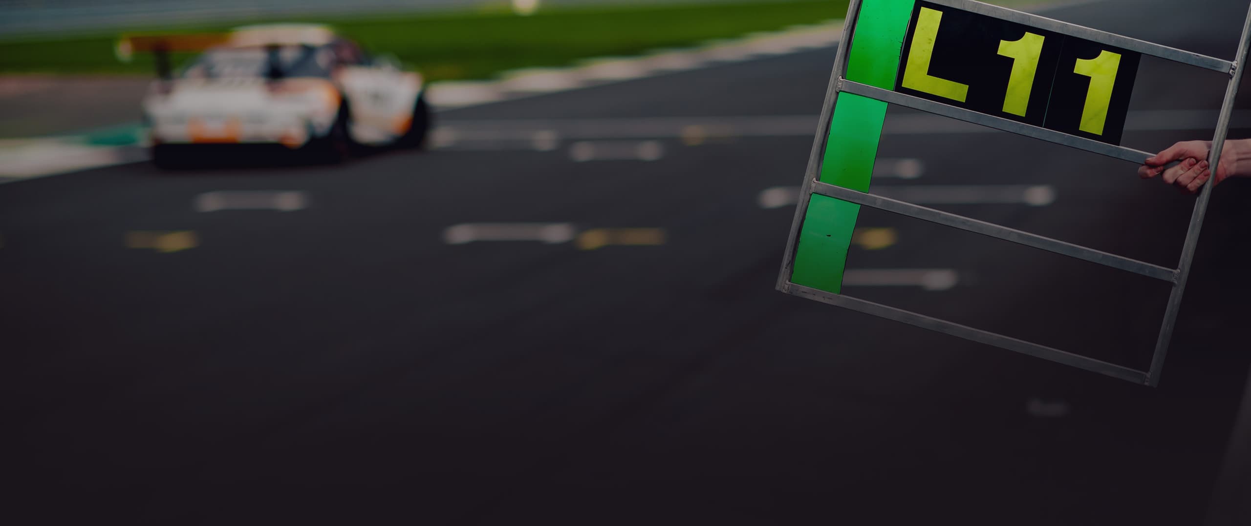 Performance Box Touch GPS performance meter on a race car dash
